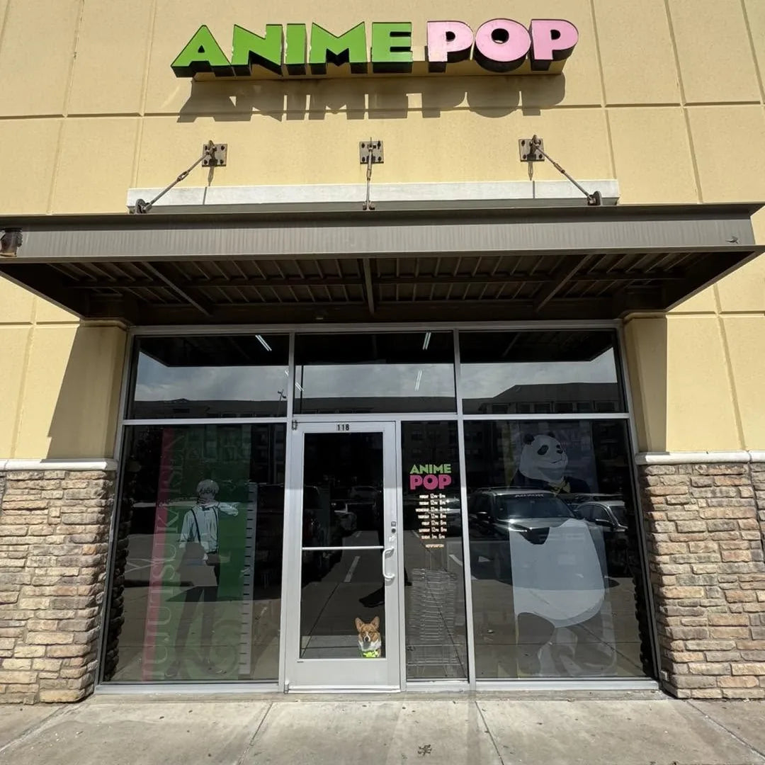 Anime Pop storefront in Addison, TX: green and pink sign above the glass doors, with Ein the corgi peeking out